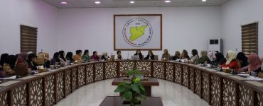 Syrian women participate in a dialogue seminar in Raqqa